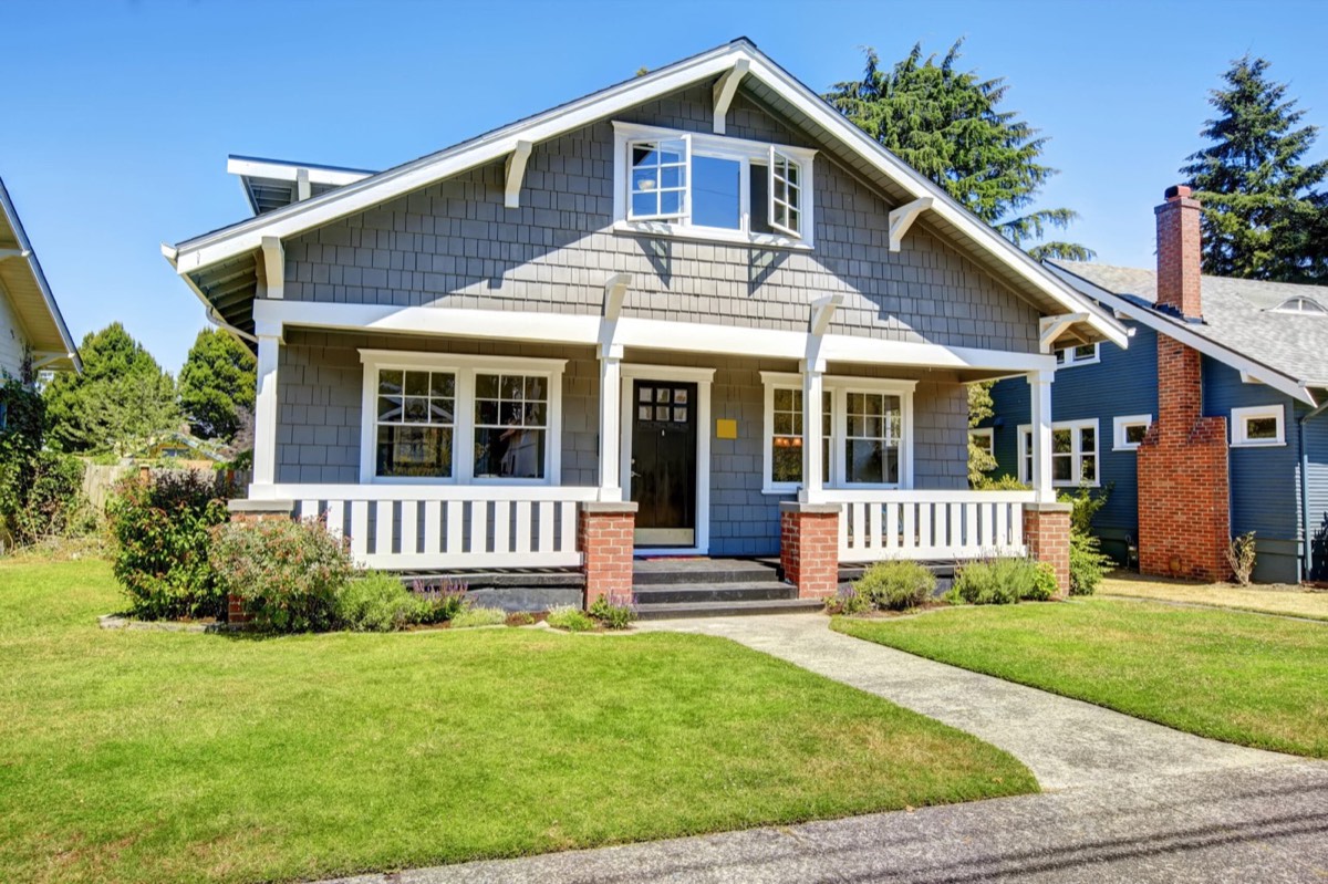 Light blue single-storey home exterior repainted by PhD Painting in Kansas City